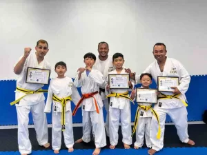 martial arts student celebrating grading & leveling up